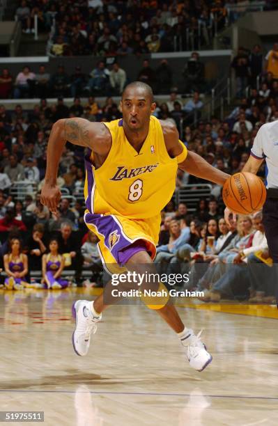 Kobe Bryant of the Los Angeles Lakers moves upcourt against the Toronto Raptors during the game at Staples Center on December 28, 2004 in Los...