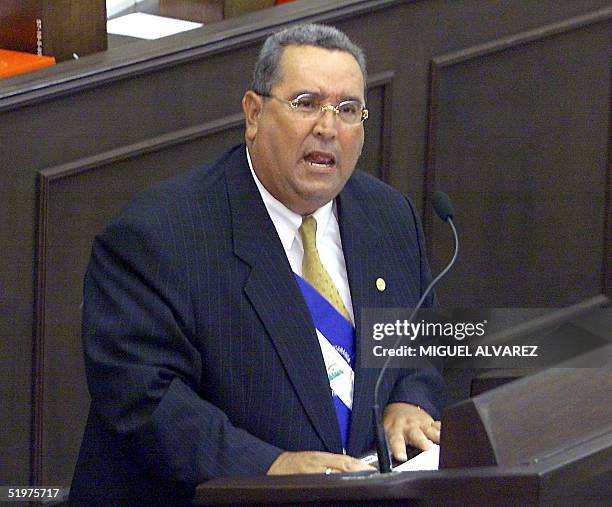 Nicaraguan President Arnoldo Aleman reads 10 January 2001 the Fourth Report of Government before the National Assembly in Managua, Nicaragua. The...