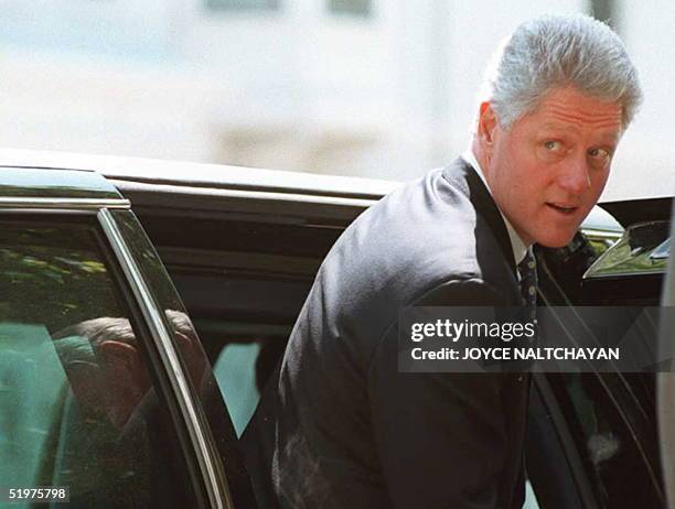 President Bill Clinton departs the Foundry Methodist Church after attending Sunday services with First Lady Hillary 28 April in Washington DC....