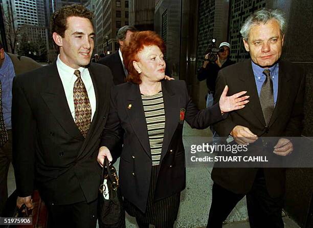 French Jazz singer Regine Choukroun walks with her son, Lionel Rotcage and lawyer Philip di Domenico after Regine and Lionel's court appearance in...