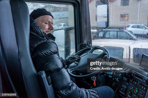 man driving a large tour bus. - バス運転手 ストックフォトと画像