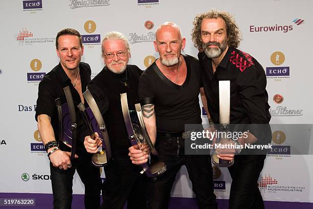 Axel Stosberg, Peter David Sage, Bjoern Both and Hans-Timm Hinrichsen of the band 'Santiano' pose with their awards at the winners board during the...