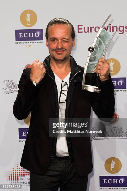 Alex Christensen poses with his award at the winners board during the Echo Award 2016 on April 7, 2016 in Berlin, Germany.