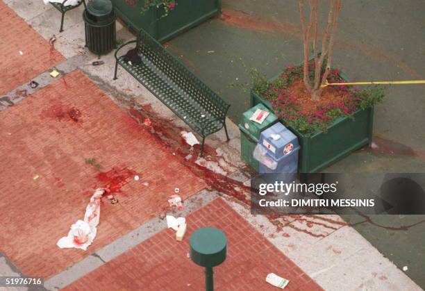 This photo taken at dawn 27 July shows the scene of the bomb blast at the Centennial Olympic Park in downtown Atlanta. Two people were killed and 110...