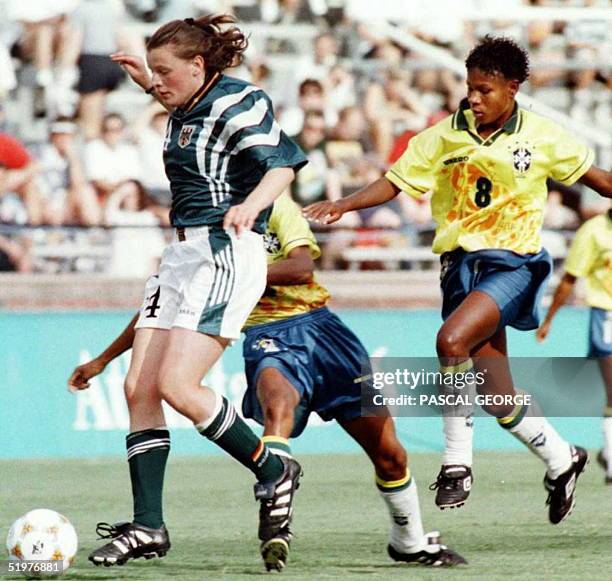 Germany's Olympic soccer team Pia Wunderlich fights for the ball with Brazil's Maciel Miraildes Mota during their women soccer Olympic Group B game...