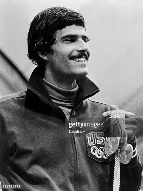 Swimmer champion Mark Spitz shows five of his seven Olympic gold medals during the Munich 1972 Olympic Games, on August 31, 1972 in Munich. Marc...