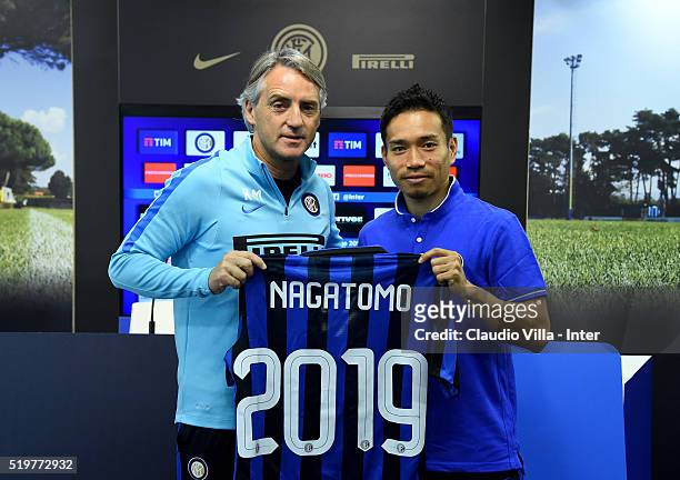 Head coach Roberto Mancini and Yuto Nagatomo of FC Internazionale pose for a photo prior to the press conference at the club's training ground at...