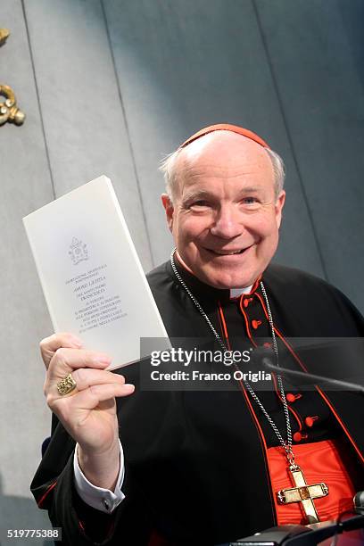 Cardinal Christoph Schonborn holds a copy of Pope Francis' post-synodal Apostolic Exhortation 'Amoris Laetitia' or 'The Joy of Love' at the Holy See...