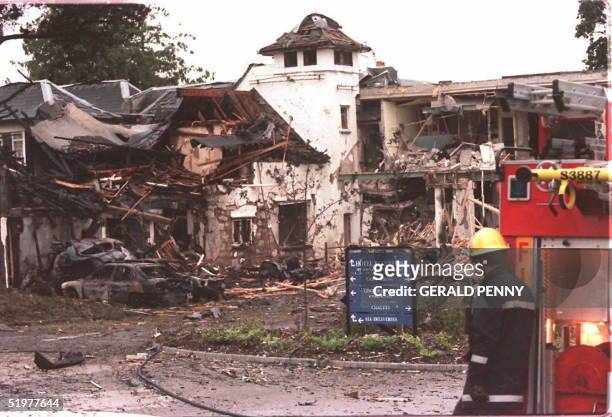 The remains of the Killyhelvin Hotel in Enniskillen stand after a car bomb exploded outside the hotel, 14 July. It is the first bombing in Northern...