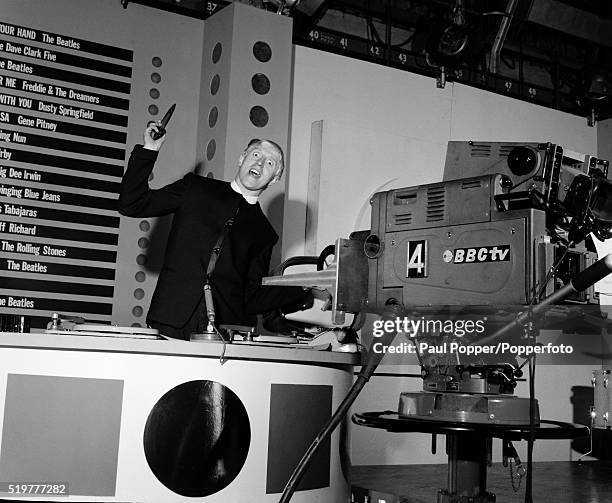 Radio and Television presenter Jimmy Savile posing during the press photocall prior to the first edition of the new popular music programme 'Top of...