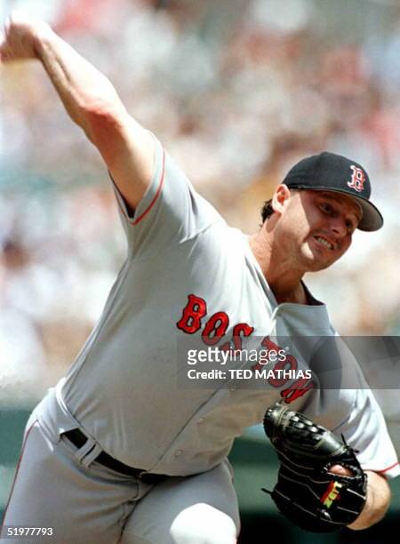 Boston Red Sox pitcher Roger Clemens delivers a home run to Baltimore Orioles' B. J. Surhoff in the third inning in Baltimore 06 July. Baltimore went...