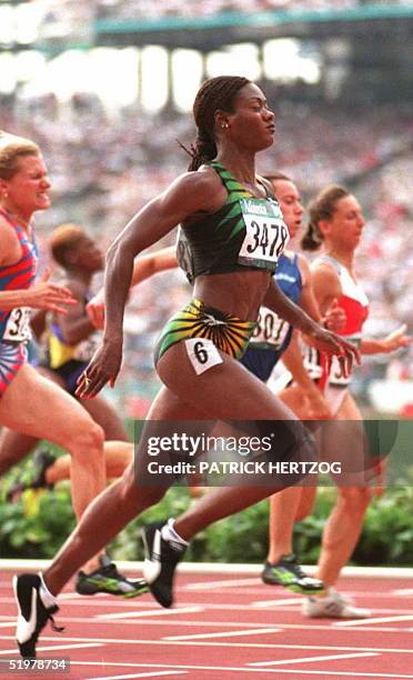 Jamaica's Merlene Ottey in action on her way to wnning her heat of the second round Olympic women's 100m race 26 July in Atlanta. Ottey holds some 30...