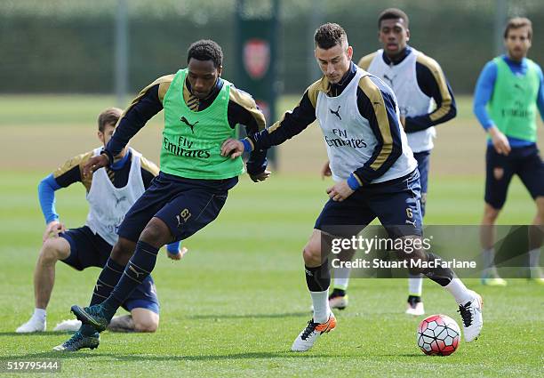 Kaylen Hinds and Laurent Koscielny of Arsenal during a training session at London Colney on April 8, 2016 in St Albans, England.