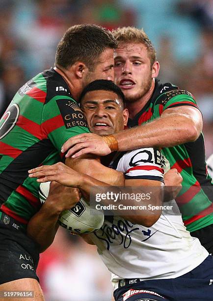 Daniel Tupou of the Roosters is tackled during the round six NRL match between the South Sydney Rabbitohs and the Sydney Roosters at ANZ Stadium on...