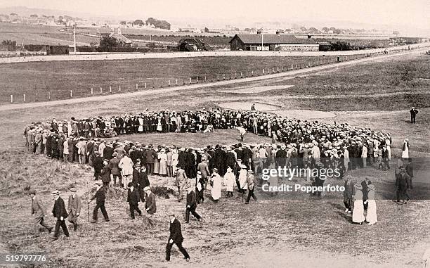 Jersey golf professional Harry Vardon putting on the ninth green during the Open Golf Championship at Prestwick, circa June 1914. On that occasion he...