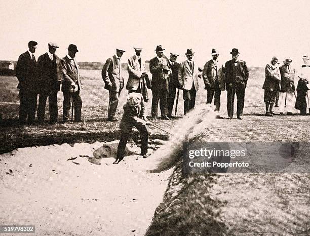 Harry Simpson shoots out of a bunker on the 5th hole at Prestwick during the British Open Golf Championship, circa June 1914.