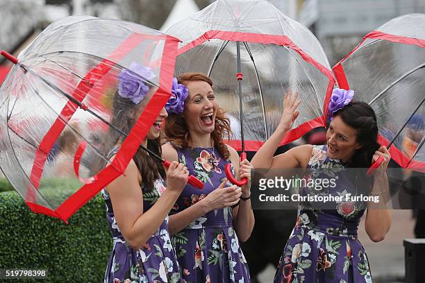 Racegoers enjoy the atmosphere of ladies Day, the second day of the Aintree Grand National Festival meeting, on April 8, 2016 in Aintree, England....