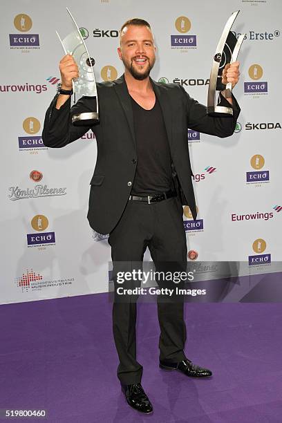 Kollegah poses with his awards at the winners board during the Echo Award 2016 on April 7, 2016 in Berlin, Germany.