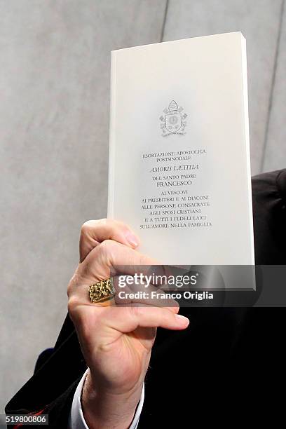 Cardinal Christoph Schonborn holds a copy of Pope Francis' post-synodal Apostolic Exhortation 'Amoris Laetitia' or 'The Joy of Love' at the Holy See...