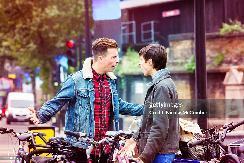 Two friends having an argument on the street