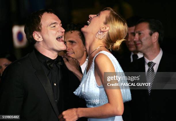 Director and jury president Quentin Tarantino and US actress Uma Thurman laugh as they arrive for the official projection of the film "Kill Bill 2",...