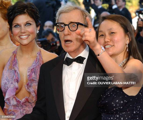 Director Woody Allen arrives with his wife Soon-Yi and US actress Tiffani Thiessen at the Palais des festivals to attend the opening ceremony of the...