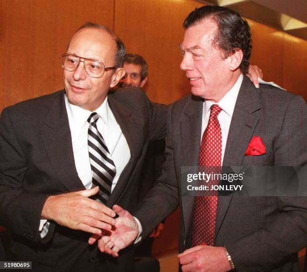 Senator Alfonse D'Amato is welcomed by World Jewish Congress President Edgar Bronfman 23 October in New York at a meeting to update the media on the...