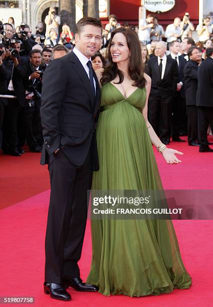 Actors Angelina Jolie and Brad Pitt pose as they arrive to attend the screening of US directors John Stevenson and Mark Osborne's animated film 'Kung...