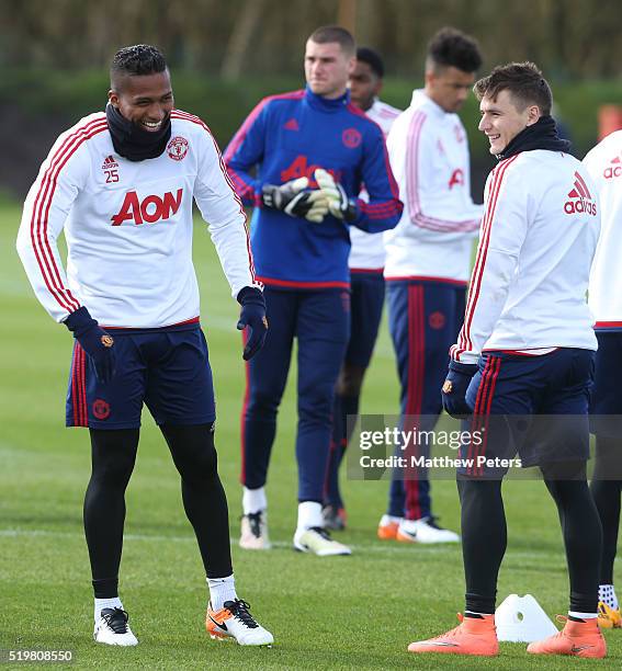 Antonio Valencia and Guillermo Varela of Manchester United in action during a first team training session at Aon Training Complex on April 8, 2016 in...