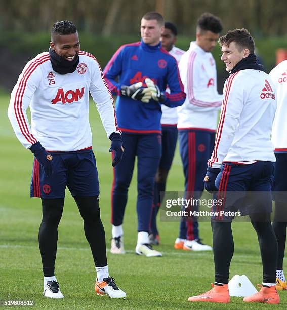Antonio Valencia and Guillermo Varela of Manchester United in action during a first team training session at Aon Training Complex on April 8, 2016 in...