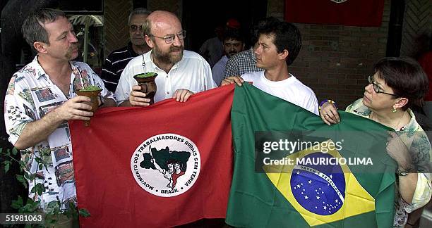 Jose Bove , French farmer leader and antiglobalization activist, drinks mate with unidentified members of the Country Workers Without Land Movement...