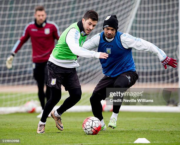 Kieran Richardson of Aston Villa in action with team mate Carles Gil during a Aston Villa training session at the club's training ground at Bodymoor...