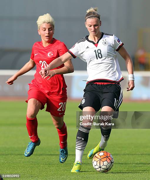 Alexandra Popp of Germany rides the ball past Cansu Yag of Turkey during UEFA Women's Euro 2017 Qualifier match between Turkey and Germany in...