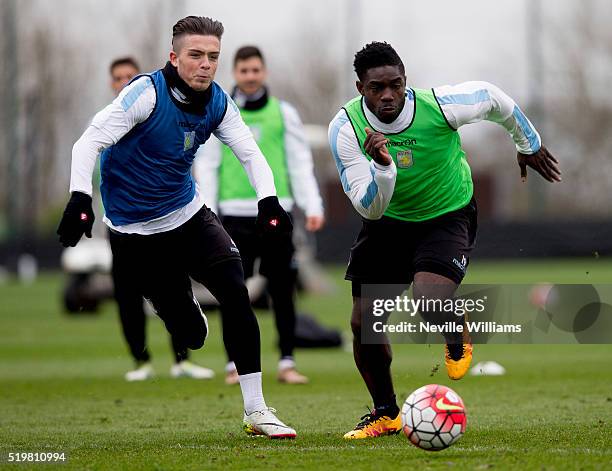 Jack Grealish of Aston Villa in action with team mate Micah Richards during a Aston Villa training session at the club's training ground at Bodymoor...