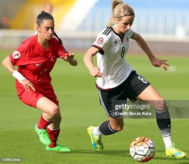 Kathrin-Julia Hendrich of Germany runs with the ball past Ceren Nurlu of Turkey during UEFA Women's Euro 2017 Qualifier match between Turkey and...