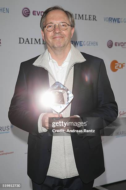Olli Dittrich poses with his award during the 52th Grimme Award on April 8, 2016 in Marl, Germany. Dittrich received the award as best director for...