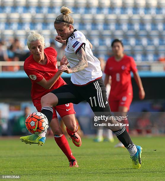 Anja Mittag of Germany battles for the ball against Cansu Yag of Turkey during UEFA Women's Euro 2017 Qualifier match between Turkey and Germany on...