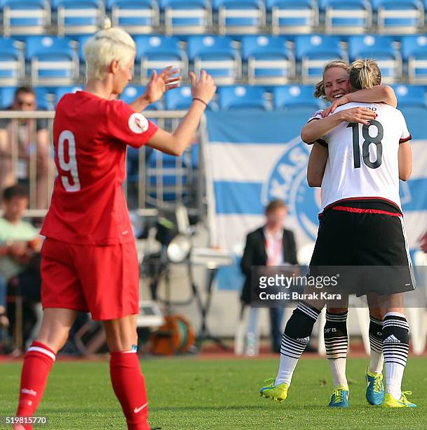 Alexandra Popp of Germany hugs her teammate as they celebrate their win against Turkey in UEFA Women's Euro 2017 Qualifier match between Turkey and...