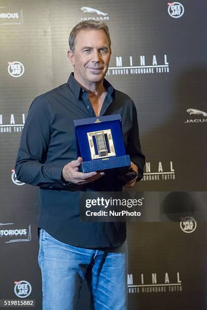 Actor Kevin Costner is awarded with the International Silver Ribbon during a photocall for 'Criminal' on April 8, 2016 in Rome, Italy.