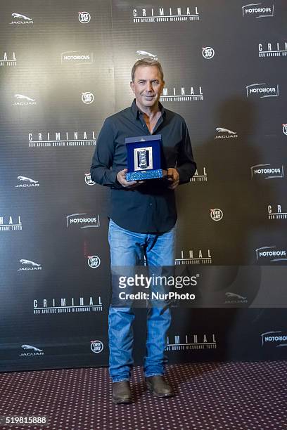 Actor Kevin Costner is awarded with the International Silver Ribbon during a photocall for 'Criminal' on April 8, 2016 in Rome, Italy.
