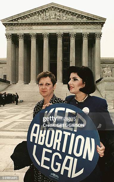 This file photo shows Norma McCorvey formally known as "Jane Roe",as she holds a pro-choice sign with former attorney Gloria Allred in front of the...