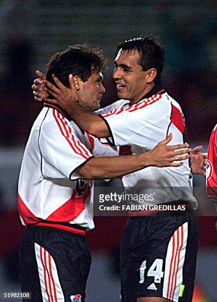 Celso Ayala celebrates his team's first goal with his teammate Pedro Saravia in Buenos Aires, Argentina, 18 April 2001, in a game against El Nacional...