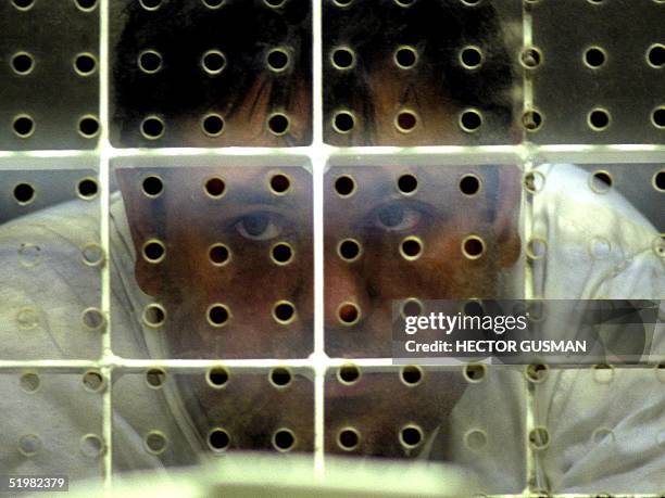 Adan Amezcua listens to questions at the Puente Grande prison 04 May 2001 in Guadalajara, Mexico. Amezcua, the suspected head of Mexico's fifth...