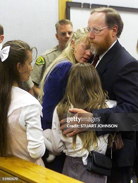 Tom Green holds his grieving wife Hannah and daughter Sierra after the jury found Green guilty on all accounts of bigamy and criminal nonsupport in...