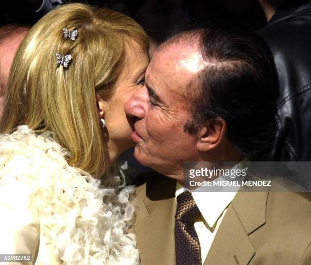 Former Argentine president Carlos Menem kisses his bride, the Chilean former Miss Universe Cecilia Bolocco following their civil wedding ceremony 26...