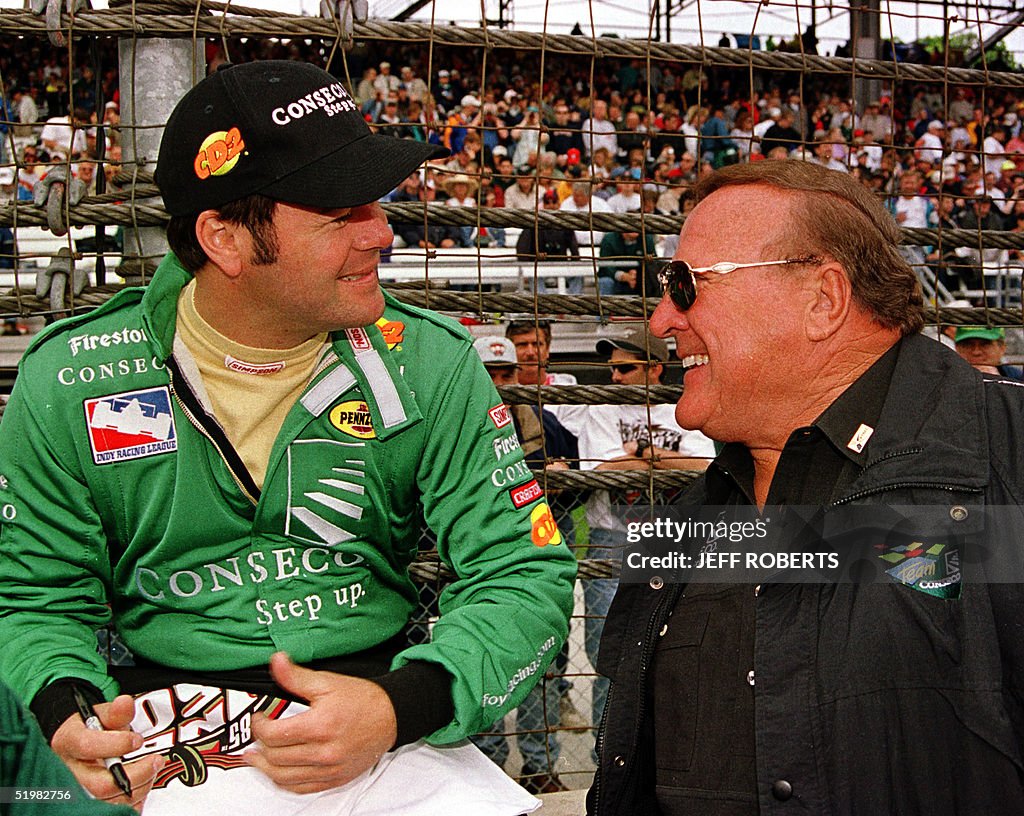 Robyn Gordon Racing Race car driver Robby Gordon talks to car owner and former winner ...