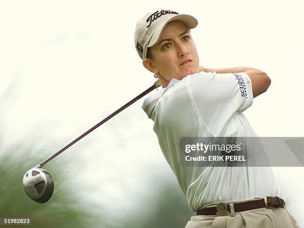 Golfer Karrie Webb of Australia watches her tee shot on the 10th hole 1 June 2001 during the second round of the US Women's Open at the Pine Needles...