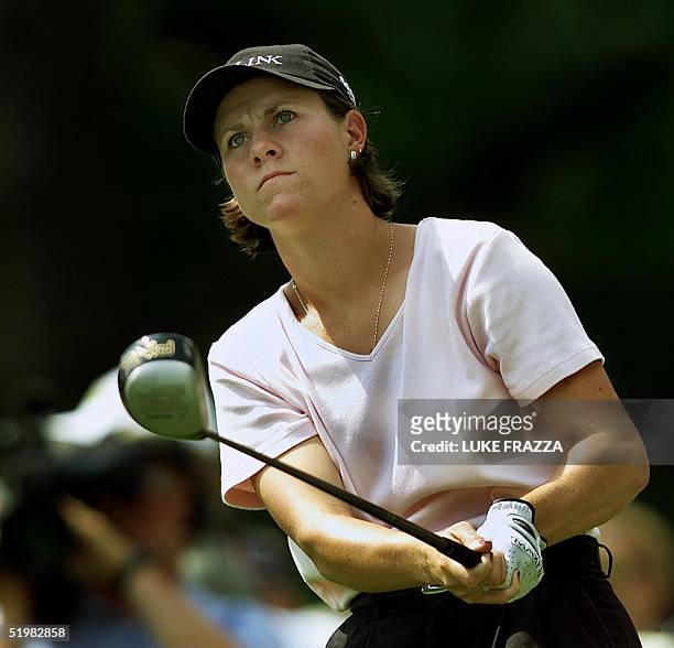 Golfer A.J. Eathorne of Canada watches her tee shot 2 June 2001 during the third round of the US Women's Open at the Pine Needles Lodge and Golf Club...