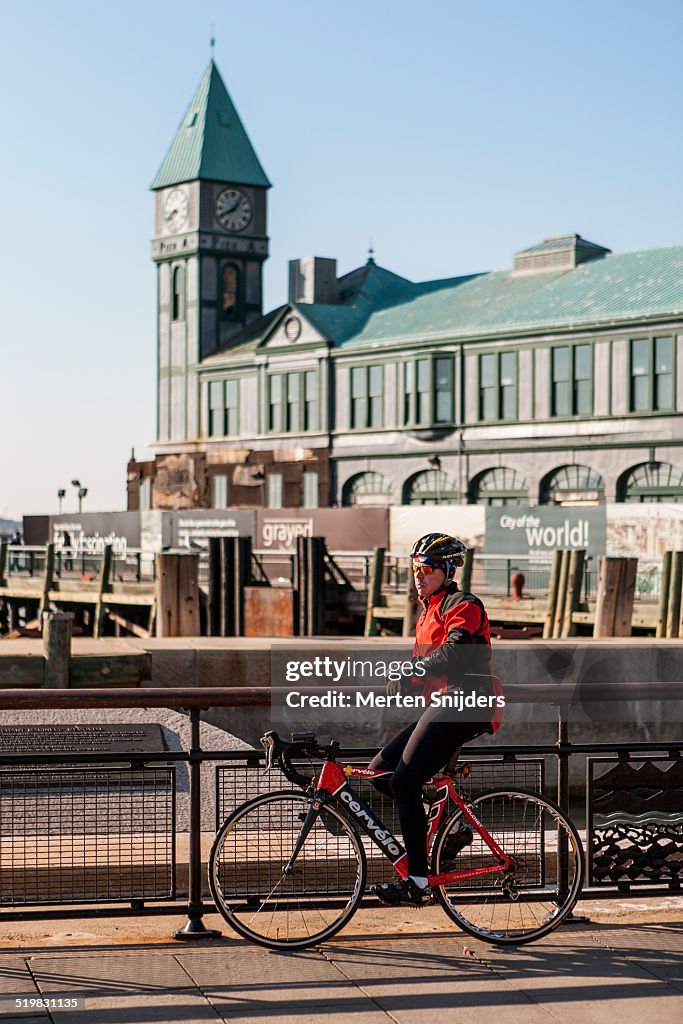 Bicycle racer resting at Battery park waterfront