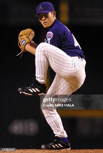 Arizona Diamondbacks relief pitcher Byung-Hyun Kim works the seventh inning against the Houston Astros, 26 June 2001, in Phoenix.